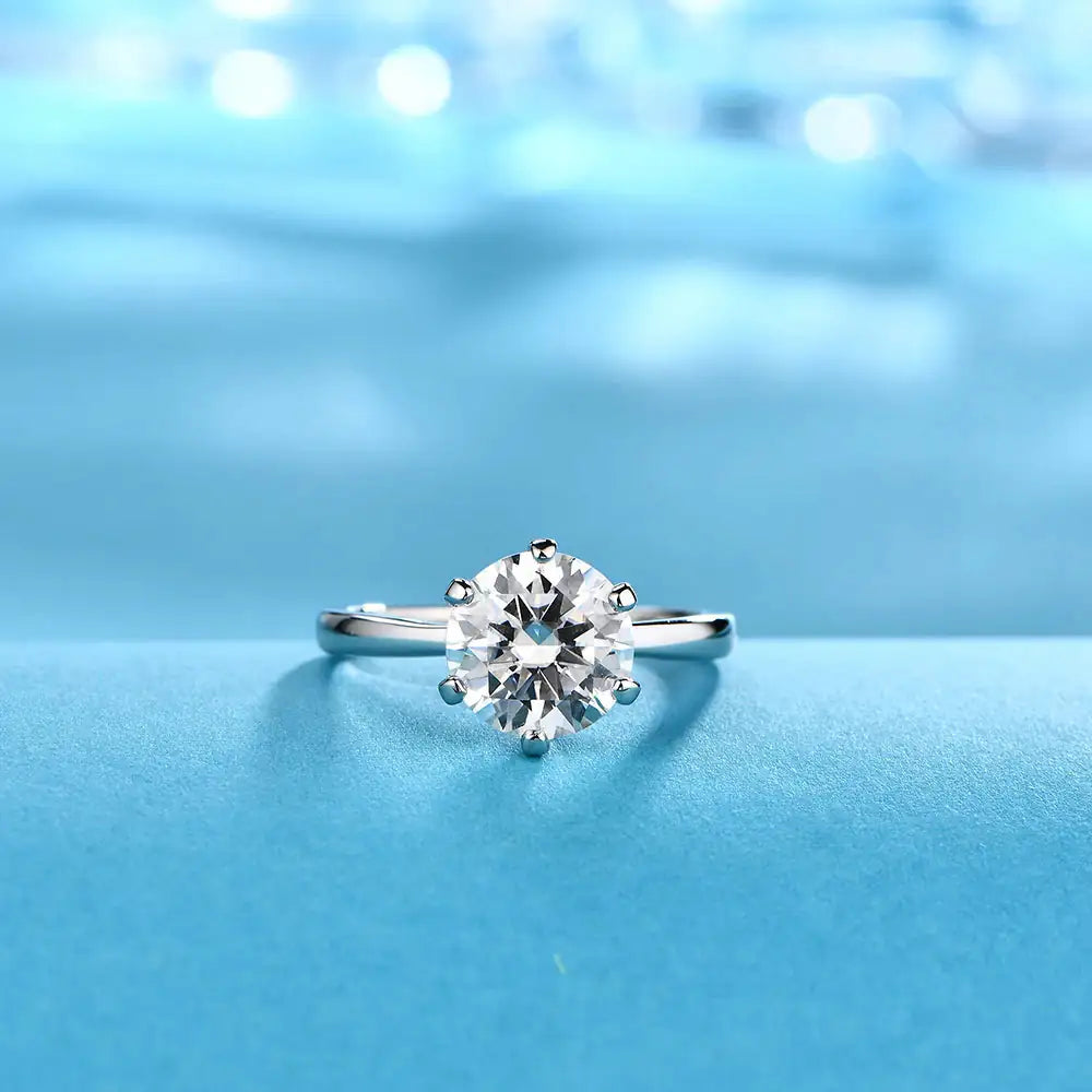 White CZ solitaire ring close-up — sterling silver, adjustable, tarnish-resistant