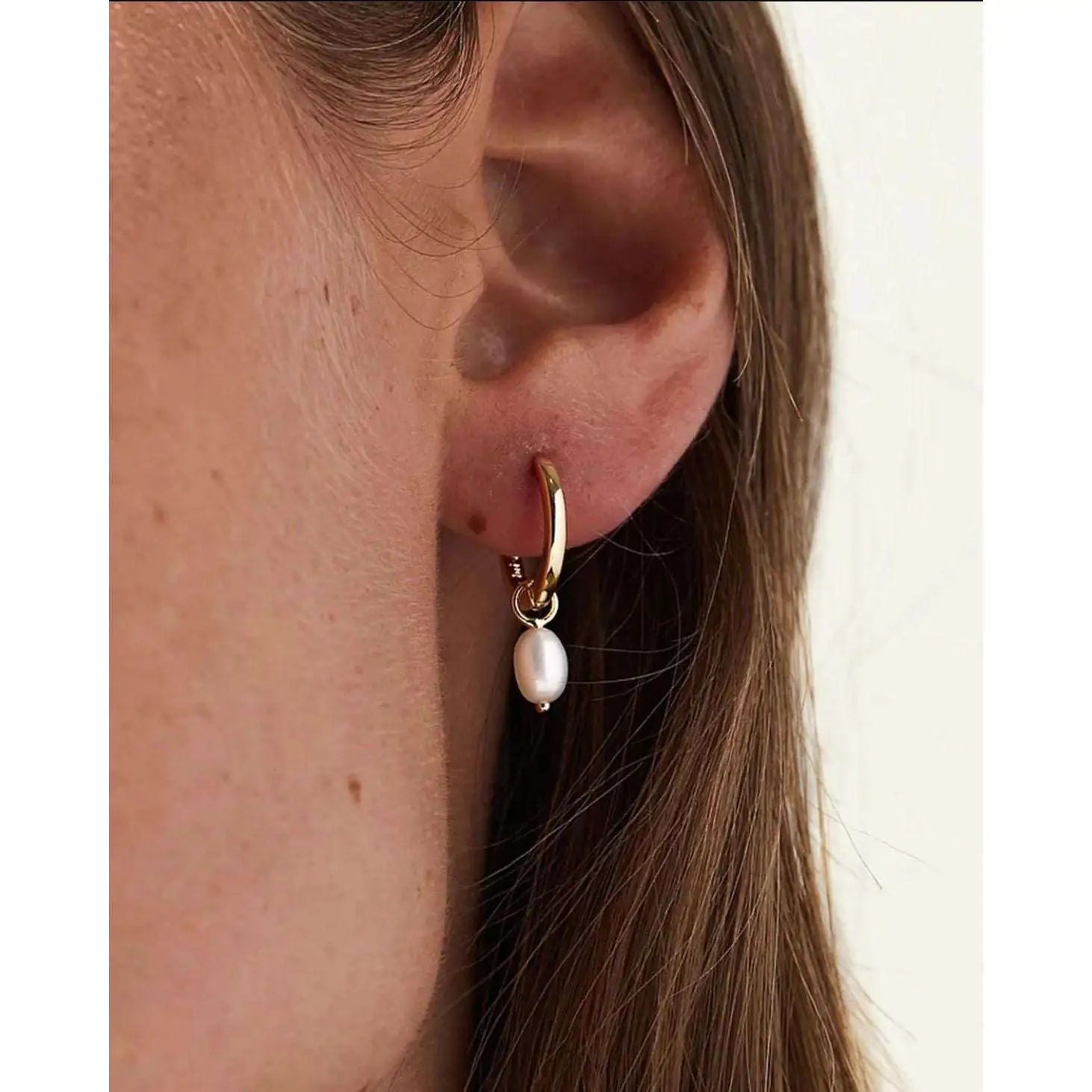 Lustrous silver drop earrings worn — 18K gold plated, 925 sterling silver