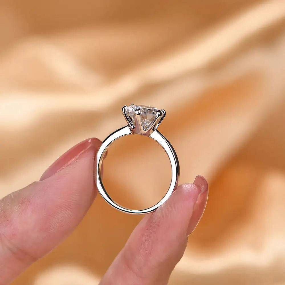 Solitaire silver ring side profile — prong-set CZ, 925 sterling silver