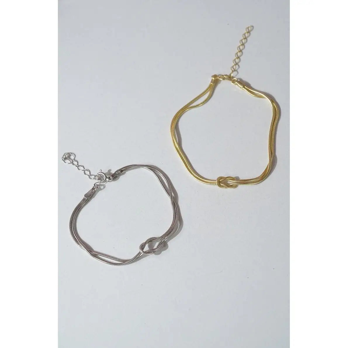 Close-up of The Bond Set couple bracelets — 925 sterling silver, one rhodium, one 18K gold plated, adjustable