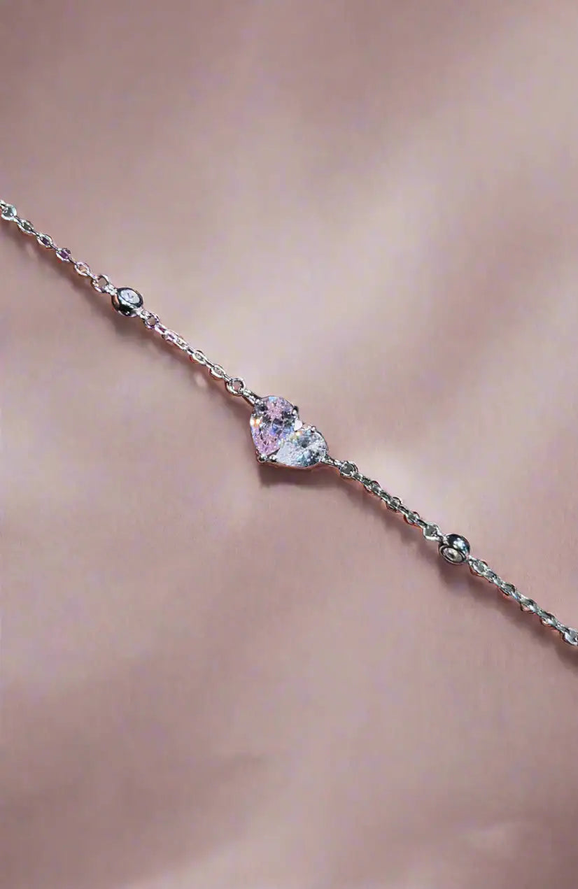 Twin Hearts silver bracelet worn on wrist — 925 sterling silver CZ hearts