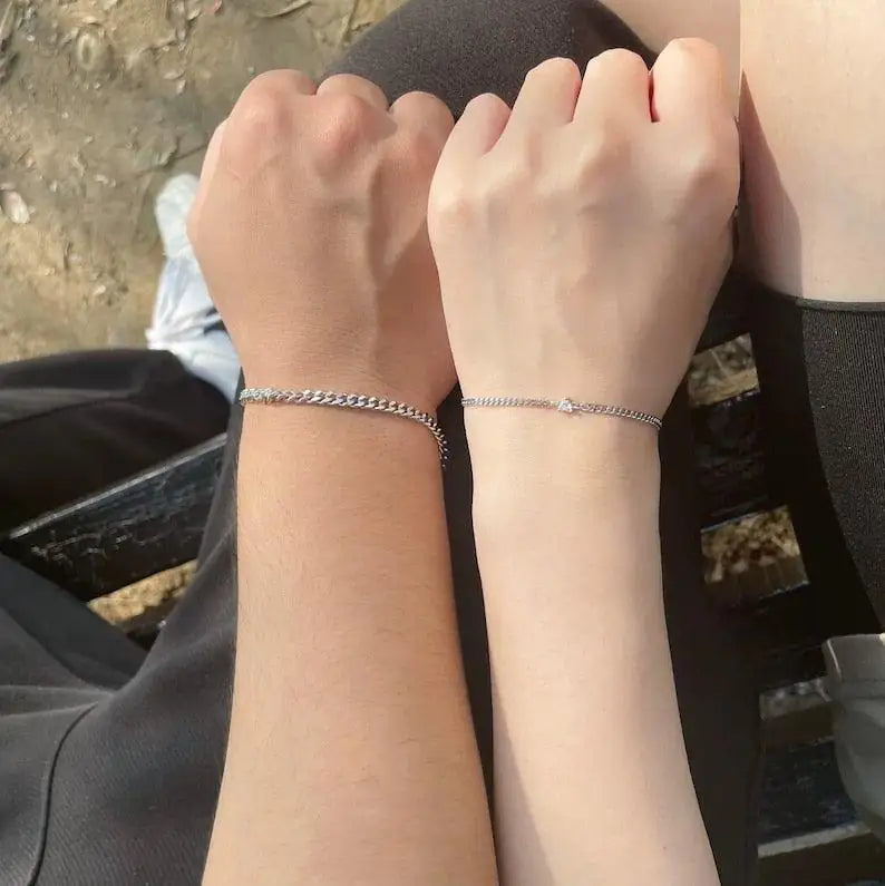Close-up of The Mirror Set 925 sterling silver matching couple bracelets — identical polished silver finish
