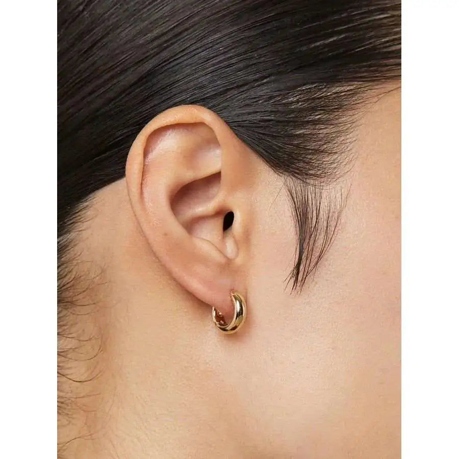 Close-up of Echo 925 sterling silver hoop earrings — polished high-shine 18K gold plated finish