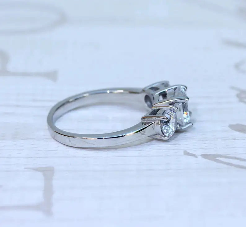 Sterling silver three-stone CZ ring on white background — elegant engagement ring 925 silver India